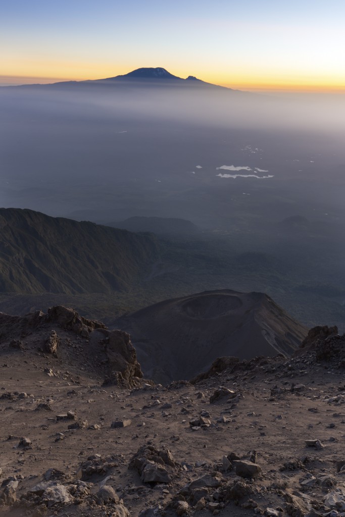 Sunrise on Mount Meru with Mt Kilimanjaro in the distance, near Arusha in Tanzania. Africa.